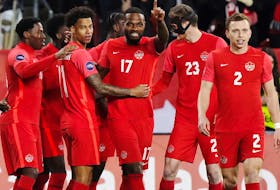 Canada forward Cyle Larin (No. 17) celebrates his goal against Honduras with teammates during Tuesday's game at BMO Field.