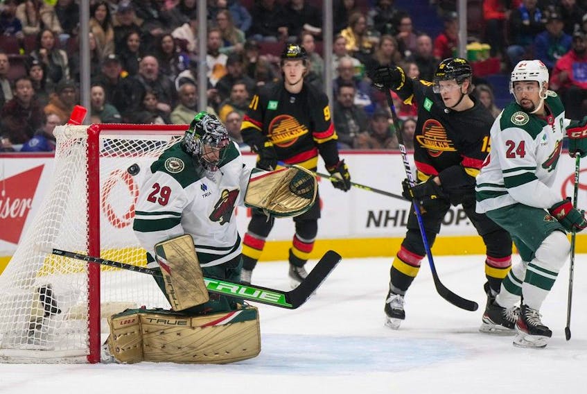  Minnesota Wild goalie Marc-Andre Fleury allows a goal to Vancouver Canucks’ Brock Boeser, not seen, as Vitali Kravtsov, back centre, Sheldon Dries and Minnesota’s Matt Dumba watch during the first period of an NHL hockey game in Vancouver, on Thursday, March 2, 2023.