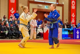 Team P.E.I.'s Brooke MacArthur, left, faces off against Marisol Savoie of Team New Brunswick during the 2023 Canada Winter Games judo competition on March 1 at the P.E.I. Convention Centre in Charlottetown. Rudi Terstege • Special to SaltWire Network