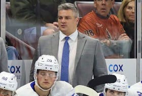 Sheldon Keefe behind the bench of the Maple Leafs against the Coyotes at Mullett Arena in Tempe, Ariz., Dec. 29, 2022.