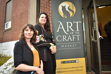 Rebecca Hill (front) and Rachel Hill stand beside their signage for Art of the Craft Market, outside the entrance into the Royal Canadian Legion hall, earlier this month. This was the third market they’ve put on but the first at the Legion which they felt was a great location.