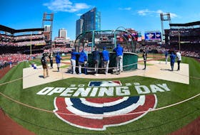 Members of the Toronto Blue Jays take batting practice prior to a game against the St. Louis Cardinals on Opening Day at Busch Stadium. 
