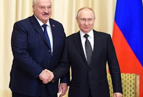 Belarusian President Alexander Lukashenko, left, shakes hands with Russian President Vladimir Putin during a meeting at the Novo-Ogaryovo state residence outside Moscow, Russia, in February.  Kremlin via Reuters