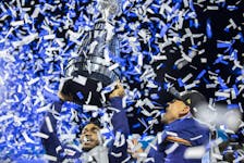 Toronto Argonauts wide receiver Brandon Banks (16) and Toronto Argonauts running back Andrew Harris (33) celebrate after defeating the Winnipeg Blue Bombers  during the 109th Grey Cup at Mosaic Stadium on Sunday, November 20, 2022 in Regina. 