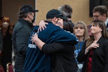 Darcy Dobson, right, daughter of victim Heather O'Brien, and Nick Beaton, husband of victim Kristen Beaton, embrace before the delivering of the final report of the Mass Casualty Commission inquiry into the mass murders in rural Nova Scotia in Truro, N.S. on Thursday, March 30, 2023. THE CANADIAN PRESS/Darren Calabrese  Darcy Dobson, daughter of victim Heather O'Brien, and Nick Beaton, husband of victim Kristen Beaton, embrace in Truro on Thursday, March 30, 2023 before the delivery of the final report of the Mass Casualty Commission inquiry into the mass murders in rural Nova Scotia.