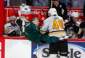 Cape Breton Eagles centre Ivan Ivan checks Halifax Mooseheads right wing Alexandre Doucet near the Eagles bench during QMJHL action in Halifax on Saturday, March 4, 2023.
Ryan Taplin - The Chronicle Herald
