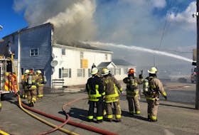 Firefighters train water on this building in downtown Digby, which was destroyed by fire on March 29. COURTESY JOHN DEMINGS