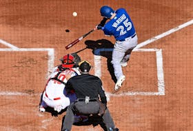 Daulton Varsho #25 of the Toronto Blue Jays hits an RBI double against the St. Louis Cardinals in the first inning on Opening Day at Busch Stadium on March 30, 2023 in St Louis, Missouri.