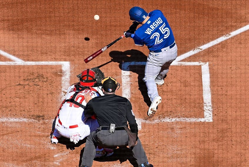 Daulton Varsho #25 of the Toronto Blue Jays hits an RBI double against the St. Louis Cardinals in the first inning on Opening Day at Busch Stadium on March 30, 2023 in St Louis, Missouri.