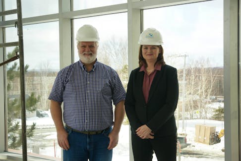 SONY DSC  Mark Griffin, left, board chairman of Lionel Kelland Hospice, and Peggy Hamilton, right, executive director, oversee construction of the new building. - R. Daley