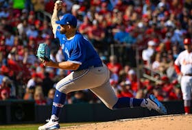 Alek Manoah  of the Toronto Blue Jays pitches against the St. Louis Cardinals in the second inning on Opening Day at Busch Stadium.
