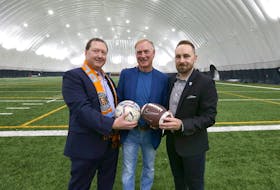 (L-R) Ron Girvitz, President, Calgary Blizzard Soccer Club, Greg Peterson, President, Dome Facilities Association & Greater Calgary Amateur Football Association and Carlo Bruneau, Executive Director, Calgary Minor Soccer Association pose as the City of Calgary and partners opened a new inflatable dome over Encana Field at Shouldice Athletic Park Wednesday, October 19, 2022. Jim Wells/Postmedia