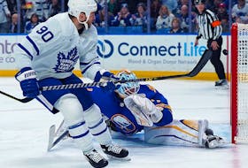 Ryan O'Reilly of the Toronto Maple Leafs scores against Ukko-Pekka Luukkonen of the Buffalo Sabres during a game at KeyBank Center on February 21, 2023 in Buffalo.