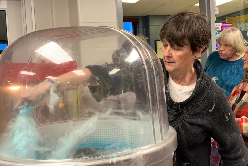 Louann Link was kept busy making cotton candy at a charity hockey game at the Sandy Wickens Memorial Arena on March 25 in support of the Jevon Link Let Your Light Shine Society, started in memory and honour of her son.  KATHY JOHNSON
