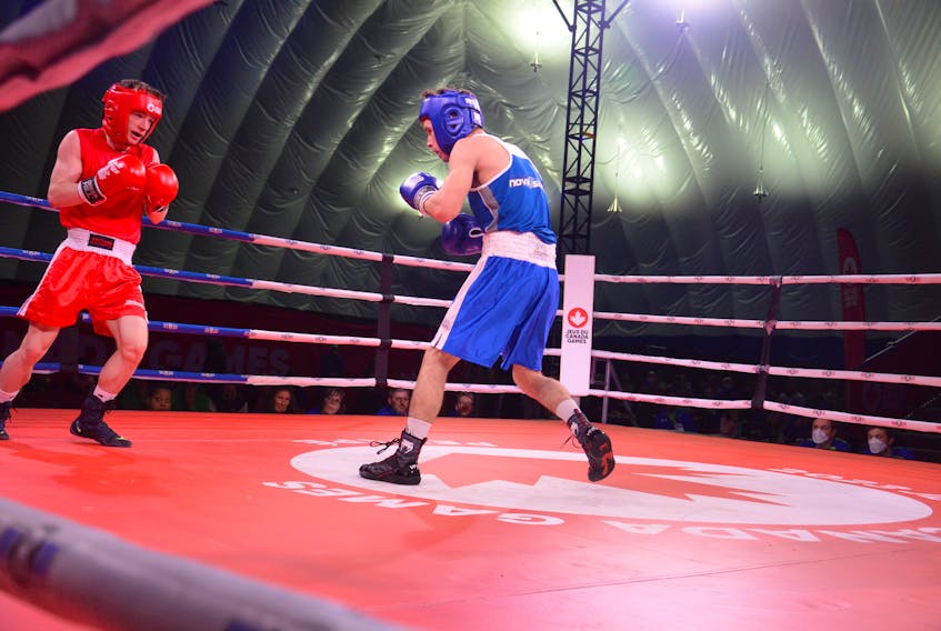 P.E.I. Matthew Mahood, left, and Nova Scotia’s Noah Thompson met in an entertaining boxing match at the 2023 Canada Winter Games on March 3. Mahood won the bout by unanimous decision to earn a berth in the bronze-medal fight on March 4. Jason Simmonds • The Guardian