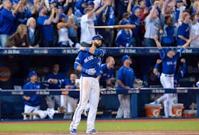 Blue Jays' Jose Bautista flips his bat after hitting a three-run homer during the seventh inning of Game 5 during the American League Division Series on Wednesday, Oct. 14, 2015. 