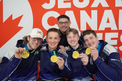 Nova Scotia defeated British Columbia 7-3 in the gold-medal game of male curling at the 2023 Canada Winter Games in Prince Edward Island on March 5. Nova Scotia went a perfect 7-0 (won-lost). Coach Craig Burgess, back, and team members, from left, skip Calan MacIsaac, third stone Nathan Gray, second stone Owain Fisher and lead Christopher McCurdy. Rudi Terstege • Special to SaltWire Network
