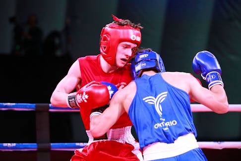 P.E.I.’s Matthew Mahood, left, and Ontario’s Simon Joseph Romero battle it out in the bronze-medal match of the featherweight 57kg weight class at the 2023 Canada Winter Games. Romero won by unanimous decision. The boxing medals attracted a full house to the Canada Games Multi-Sport Dome at Credit Union Place in Summerside on March 4. Rudi Terstege • Special to SaltWire Network