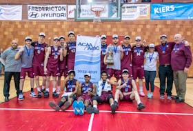 The Holland Hurricanes men’s basketball team celebrates after winning the ACAA championship on March 5. Team members include, front row, from left, Kyree Thompson, Chris Cheatham, Jalen Menzies and Ryan MacKinnon, and back row, from left, Lonnie States (assistant coach), Jacob Arsenault, Nick Mills, Spencer Rossiter, Jack MacAulay, Marcellus Taliaferro, Logan Rempel, Almin Dervisevic, Vicente Balitaan, Chris Druken, Haley MacDonald (physiotherapist), William Muirhead (assistant coach) and Tim Kendrick (head coach). Contributed