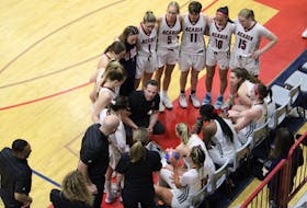 Head coach Len Harvey speaks to his Acadia Axewomen basketball team during a timeout Feb. 11 in the team’s last home game.
Jason Malloy