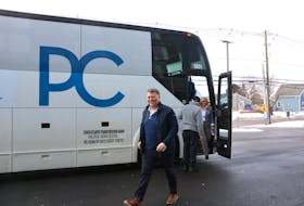 Progressive Conservative party leader Dennis King strolls off a campaign bus in Summerside on the first day of the province's election campaign. King made an announcement about his plans to address wait times in Hospital Emergency rooms on March 7. Stu Neatby • The Guardian