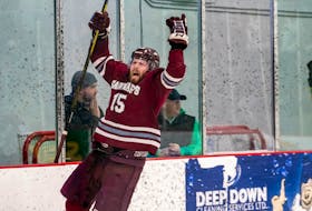 Saint Mary's forward Dawson Theede celebrates his game-winning goal in double overtime Tuesday night as the Huskies edged the UNB Reds 6-5 in Game 2 and force a third and deciding game in the best-of-three AUS hockey final. - SMU ATHLETICS