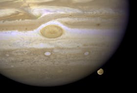 Jupiter's largest moon Ganymede (on the lower right), slips behind the giant planet in this image captured by the Hubble Space Telescope on April 9, 2007. Ganymede, which is bigger than the planet Mercury and completes an orbit around Jupiter every seven days, is one of the 95 known natural satellites orbiting Jupiter, though more are expected to be found as observations of the planet continue. Photo courtesy of the NASA Image and Video Library