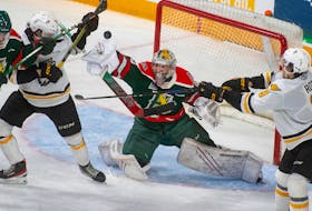 Halifax Mooseheads goalie Mathis Rousseau knocks away a shot from Cape Breton during the second period of QMJHL playoff action in Halifax on Friday, March 31, 2023. Rousseau turned aside 37 shots and was named the first star of the game in Halifax's 4-1 win.
Ryan Taplin - The Chronicle Herald