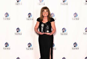 Jackie Putnam pictured with the two North American Country Music Association International awards she was presented with during a ceremony last month in Pigeon Forge, Tennessee. Contributed