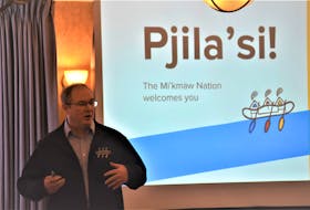 North American Indigenous Games CEO Brendon Smithson address his Truro and Colchester Chamber of Commerce audience while the theme of the upcoming event is displayed on a screen. Richard MacKenzie