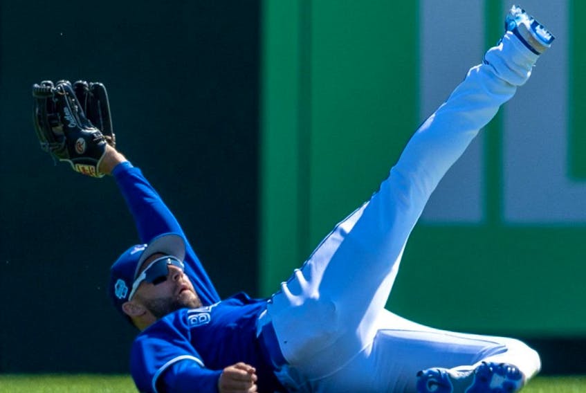 Toronto Blue Jays centre fielder Kevin Kiermaier makes a diving catch against the Baltimore Orioles in the fourth inning during spring training game. 