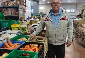 David Eastcott of the Colchester Food Bank allocates Feed Nova Scotia items distributed to the Truro-based food bank, which is seeing an increasing number of visitors this year. CONTRIBUTED