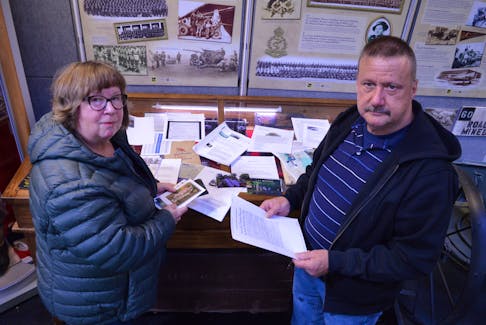 Joyce Phillips, left, and Greg Gallant, curator of the P.E.I. Regiment Museum, are looking for help finding a photo of John Bernard Murray, a lance corporal with the North Nova Scotia Highlanders who was killed by the 25th Panzergrenadier Regiment June 7, 1944. Alison Jenkins • The Guardian