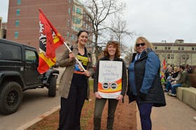 Sofie Quinn, left, Amanda Creamer and Shelley McKenna work with the Treasury Board and are on strike as of April 19.  Alison Jenkins • The Guardian