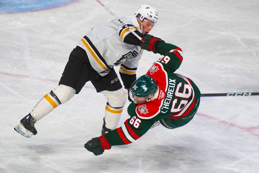 Cape Breton Eagles defenceman Conor Shortall knocks down Halifax Mooseheads left wing Zachary L'Heureux during QMJHL playoff action in Halifax on Saturday, April 1, 2023. 
Ryan Taplin - The Chronicle Herald