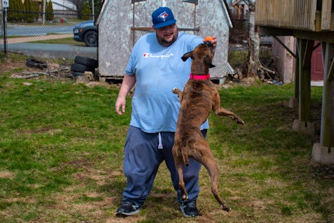 Derrick Bona plays with his dog Rosie at their Eastern Passage home on Wednesday, April 19, 2023. Bona has been documenting his weight-loss experience on Twitter.
Ryan Taplin - The Chronicle Herald