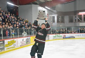 Southern Shore Breakers forward Jesse Sutton raises the Herder Memorial Trophy for the first time in his senior hockey career Sunday afternoon at the Ken Williams Southern Shore Arena. Nicholas Mercer/The Telegram