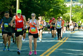 Runners make their way up the dreaded "hill" on Cornwall Avenue during 90th running of the Tely 10 in 2017.