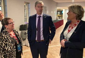 Premier Tim Houston, flanked by Janet Hazelton, president of the Nova Scotia Nurses' Union, right, and Pauline Worsfold of the Canadian Federation of Nurses Unions, talk at the NSNU annual convention in Truro on Tuesday. - Francis Campbell