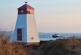 A boat races back into Murray Harbour, passing by the Douse Point Front Range lighthouse during setting day for the P.E.I. spring lobster season on April 26. Rafe Wright • The Guardian