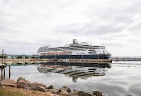 Holland America's Zaandam is reflected in the calm waters along the Charlottetown waterfront on April 26. Drew Bloksberg • The Guardian
