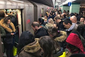 Commuters jam subway cars in Toronto. Canada added about one million new residents in 2022.