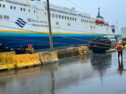 Stevedores in Port aux Basques secure the MV Leif Ericson to the dock in advance of Hurricane Fiona. – Photo Courtesy of Marine Atlantic