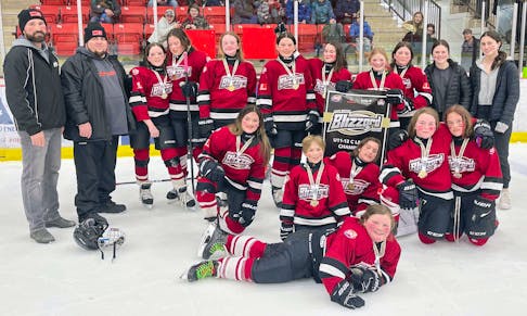 In the under-11-13 hockey league, the gold medal game was a tight battle between regular season champion Cape Breton Blizzard Orange and second-place Cape Breton Blizzard Red. The Blizzard Red rookies led the team to an upset victory of 1-0 in the championship game on March 8 in Membertou. The shutout was posted by goalie Bella Jones and goal scored by Julia Callary. Front row, Madison Poirier. Middle row, from left, Jaylee Spence, Norah Burrows, Bella Jones, Sophia Foster and Evie Yates. Back row, from left, Scott MacNeil (coach), Robert Burrows (coach), Maelle Gascoyne, Allison Miller, Martie Black, Julia Callary, Alex MacNeil, Olivia Forrest, Brielle Young, Ashlyn Tierney (coach) and Julia MacKinnon (coach). Missing from photo was Zoe Burman. CONTRIBUTED/CAPE BRETON BLIZZARD HOCKEY ASSOCIATION