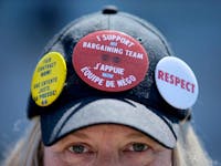 Striking PSAC worker Sue Groult wears her heart on her head while picketing in Ottawa Friday.
