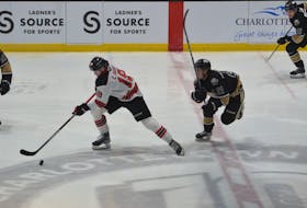 Charlottetown Islanders forward Owen Hollingsworth, 21, backchecks against the Quebec Remparts’ Charles Savoie, 18, during a Quebec Major Junior Hockey League (QMJHL) playoff game at Eastlink Centre on April 5. The Remparts won the game 5-1 to sweep the best-of-seven series. Jason Simmonds • The Guardian