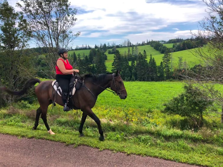 Donna Lee Cole rides her ex-racing standardbred Zero along a section of the Confederation Trail. Contributed