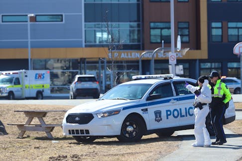Halifax Regional Police are shown at Charles P. Allen High School in Bedford on March 20 after a student allegedly stabbed two school employees.