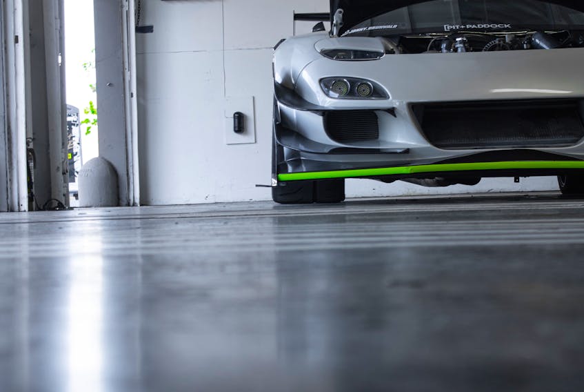 Sealing your garage floor is a must if you ever park a salt-laden, slush-coated vehicle on it. Komorebi/Unsplash