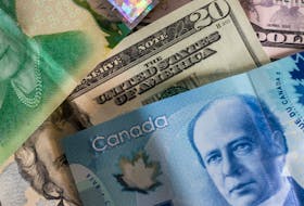 Canadian and U.S. money. - John McArthur on Unsplash
